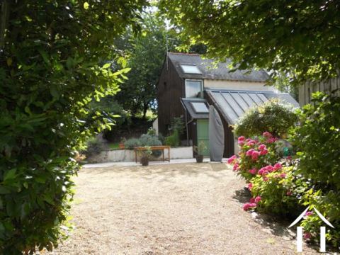 Dit is het  gemoderniseerde gastenverblijf dat ook als gite gebruikt kan worden. Het ligt haaks op de hoofdwoning, naast het overdekte zwembad.