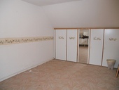 The separate bedroom on the 1st Floor. This room also has a dormer window and fitted wardrobes.