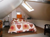 The whole of the First Floor is given over to the main bedroom. Natural light is via velux windows set into the back roof line.