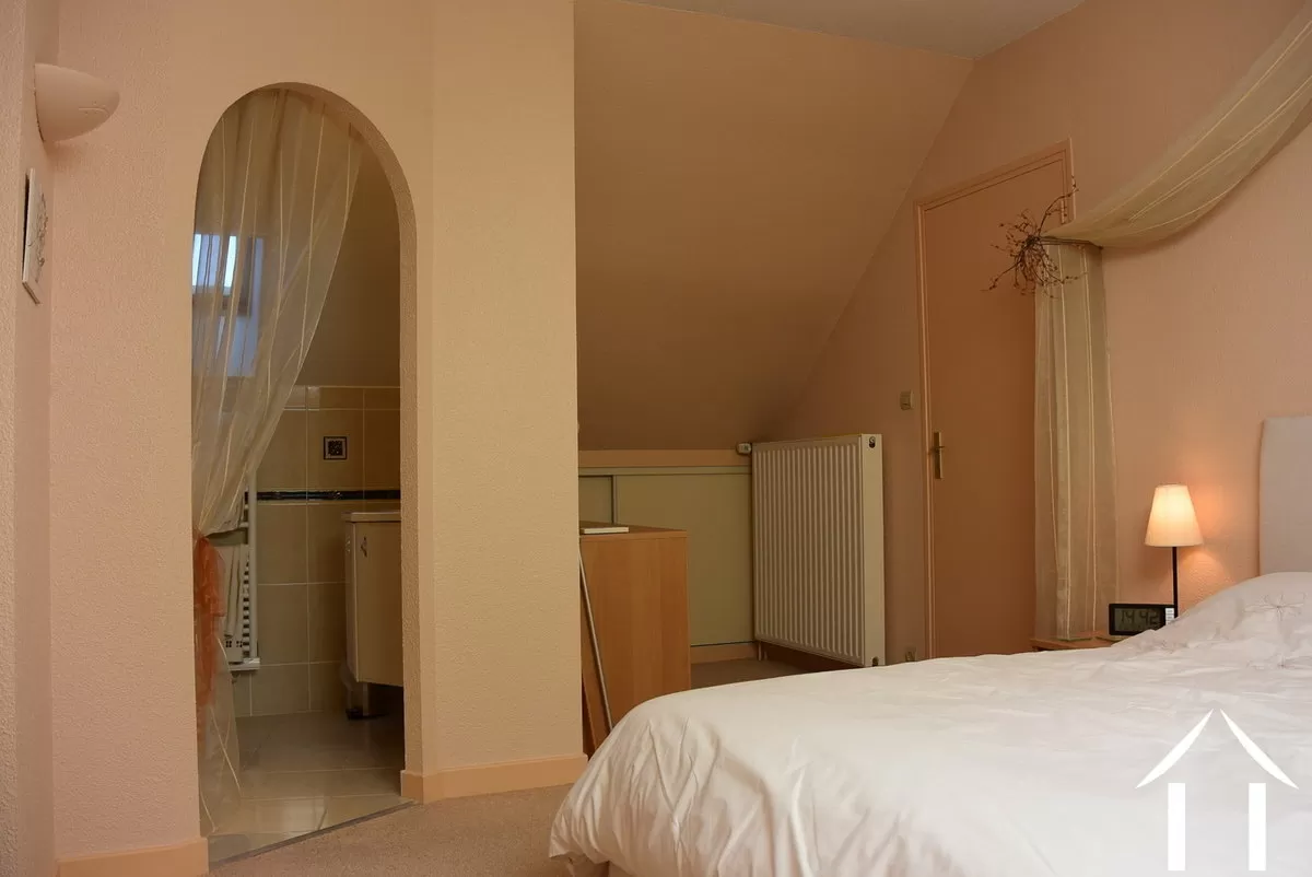 main bedroom on the first floor with bathroom