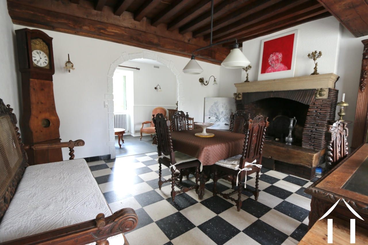 Huis 1: Woonkamer met leesruimte achterin