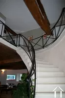 stone staircase to mezzanine and three bedroms +guest room