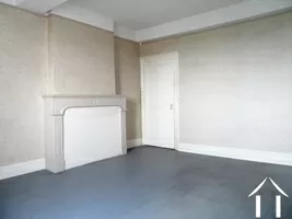 first bedroom with original fire place