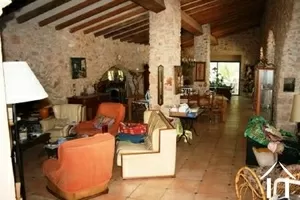 living room with beams and natural stone walls