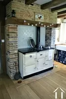 wood stove in kitchen that heats the house