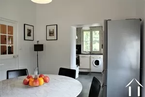good sized kitchen with dining area