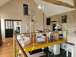 Mezzanine naar de hoofdslaapkamer en tweede bovenverdieping