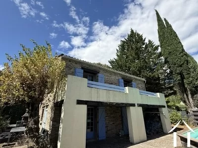 Stone house with great views on a A1 location in the small town of Lalamou les Bains, offering a large panel of amenities and shops. Ref # EG11-2561 