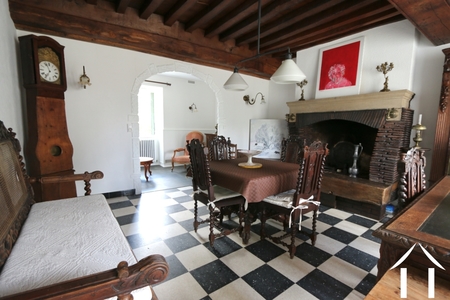 Huis 1: Woonkamer met leesruimte achterin