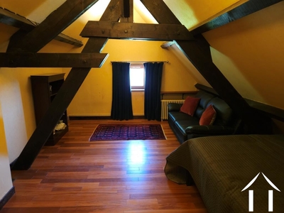 Slaapkamer met zichtbare balken